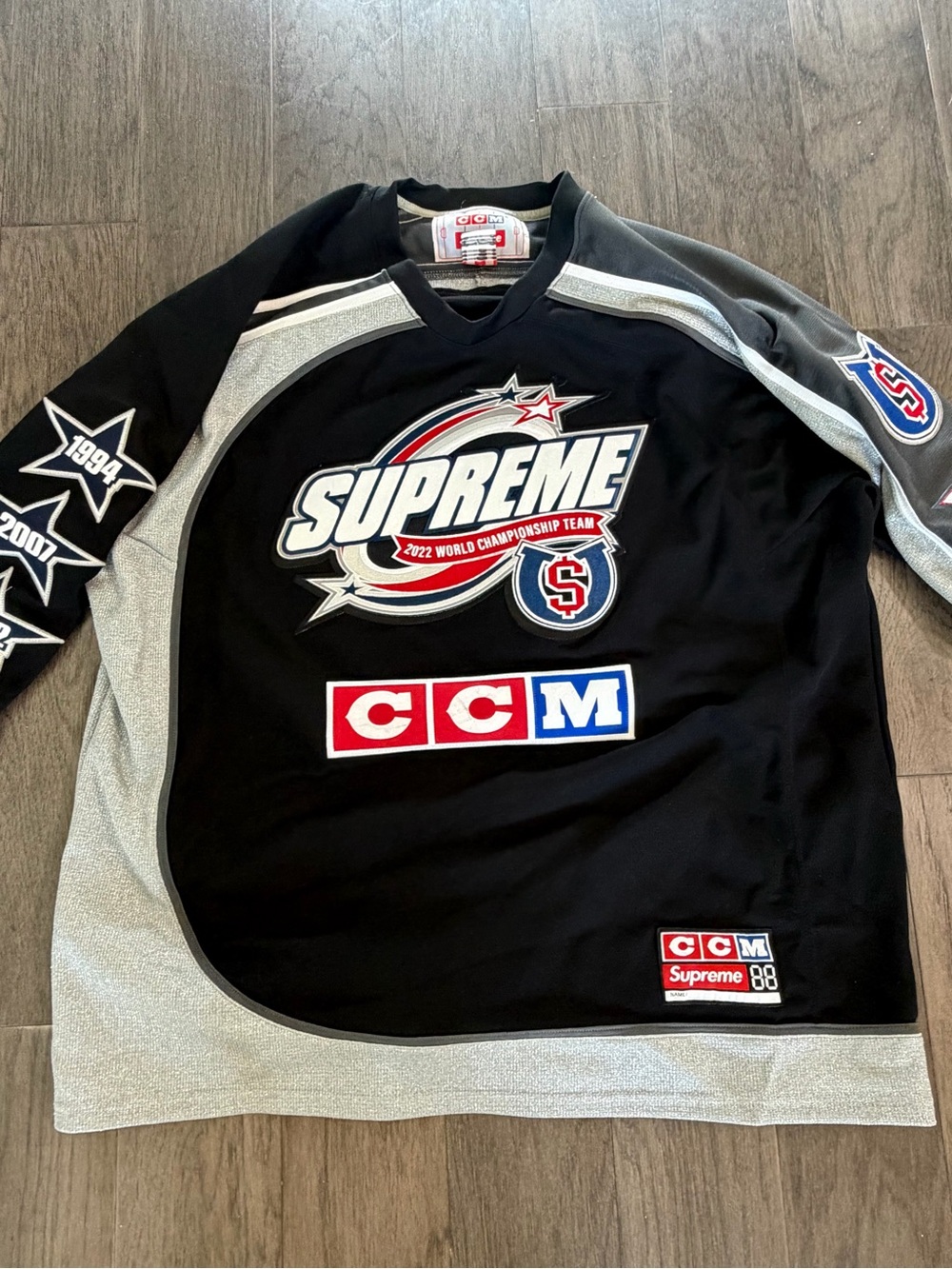 Supreme Black Hockey Jersey with Red, Blue & Silver Logo